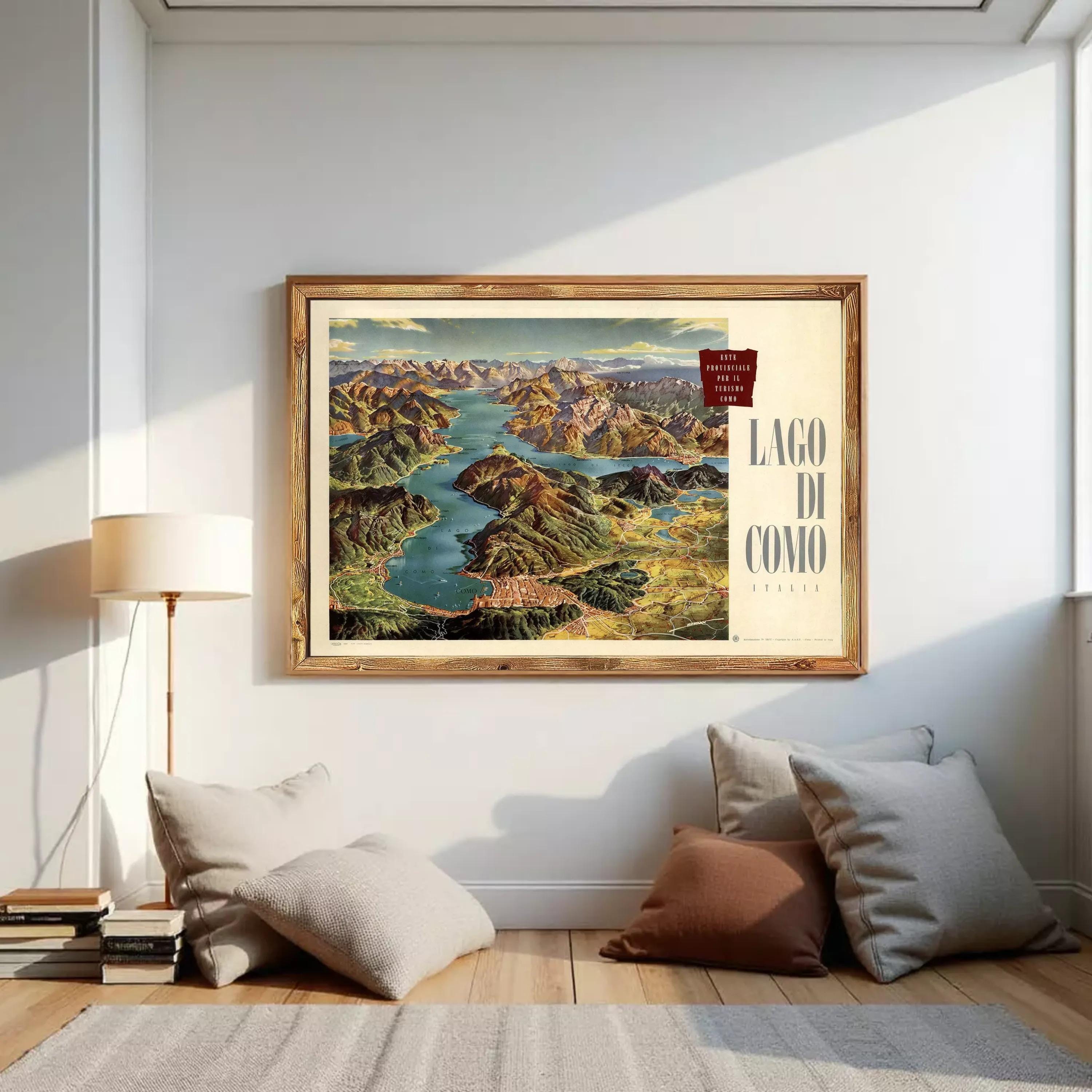 The image is a framed vintage map of Lago Di Como, Italy, depicting a scenic landscape with mountains, a river, and a town.