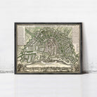 The image is a framed antique map of Amsterdam, Netherlands, depicting the city's layout and surrounding areas.
