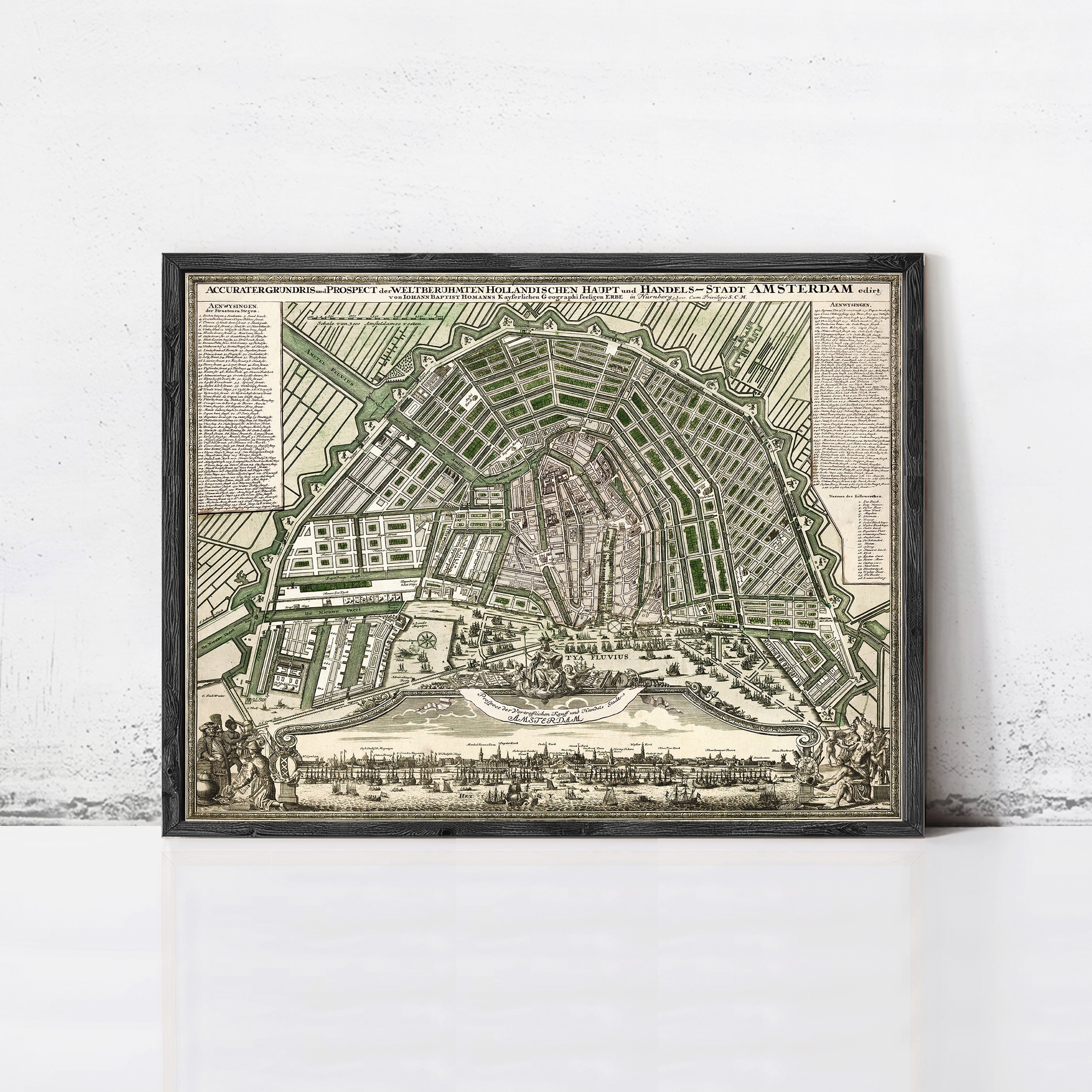 The image is a framed antique map of Amsterdam, Netherlands, depicting the city's layout and surrounding areas.