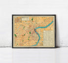 The image is a framed vintage map of a city, likely from the early 20th century, with a focus on the urban layout and surrounding areas.