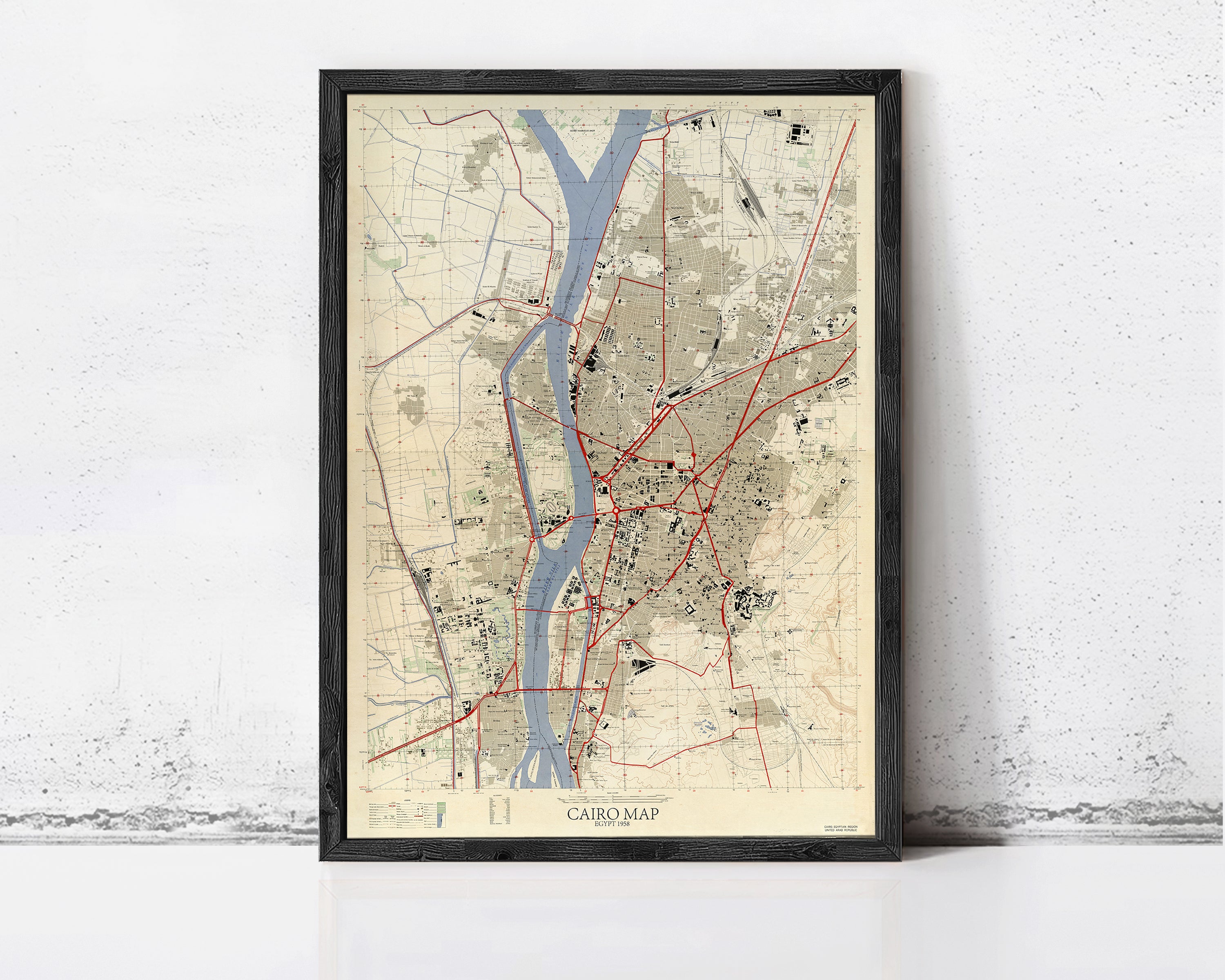 The image is a framed map of Cairo, Egypt, showing the city's streets, landmarks, and surrounding areas.