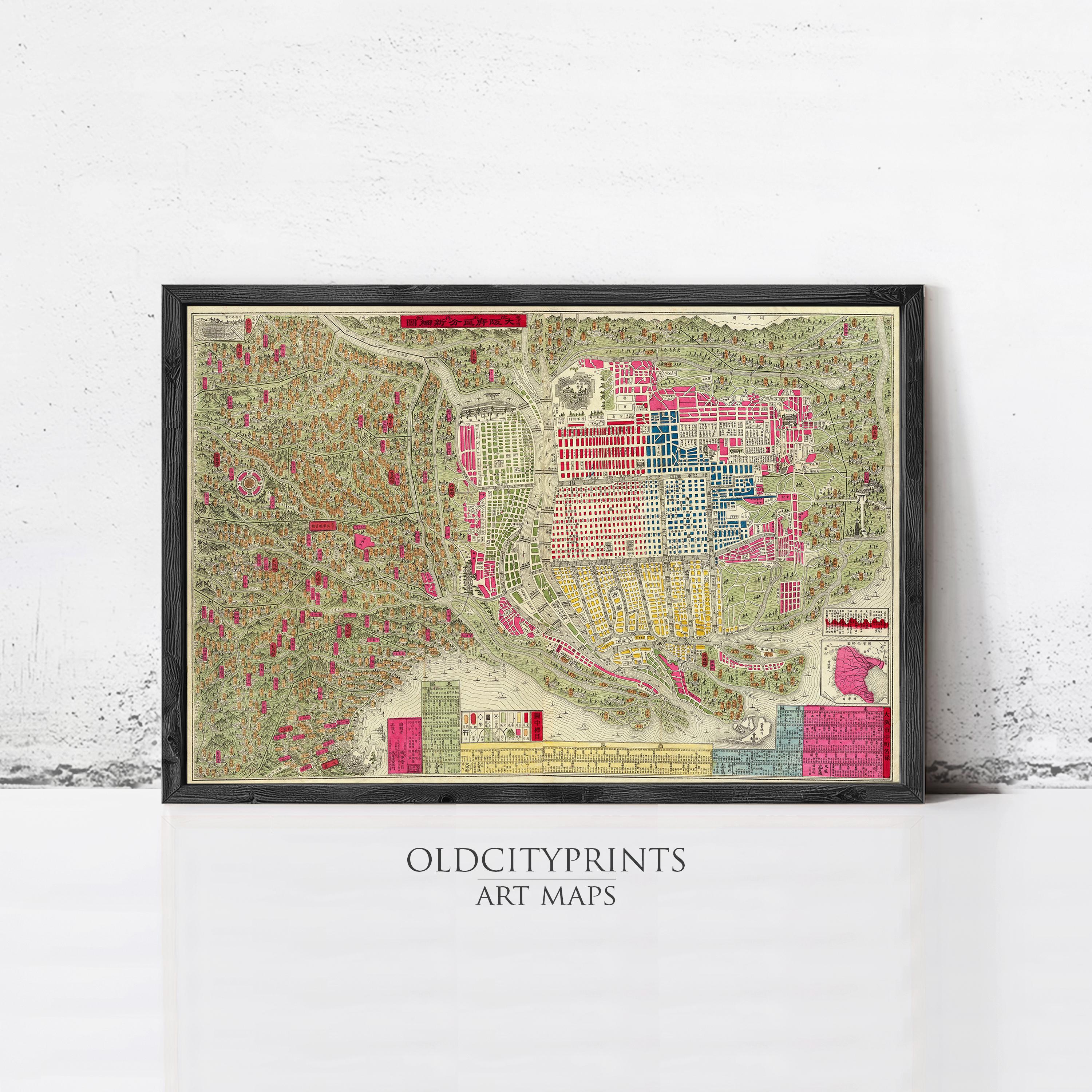 The image is a framed art map of an old city, depicting the layout and features of the city in a detailed and colorful manner.