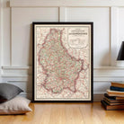The image is a framed map of Luxembourg, showing the country's roads and surrounding areas.