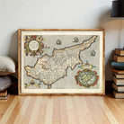 The image is a framed vintage map of the island of Cyprus, depicting the country's geographical layout and surrounding areas.