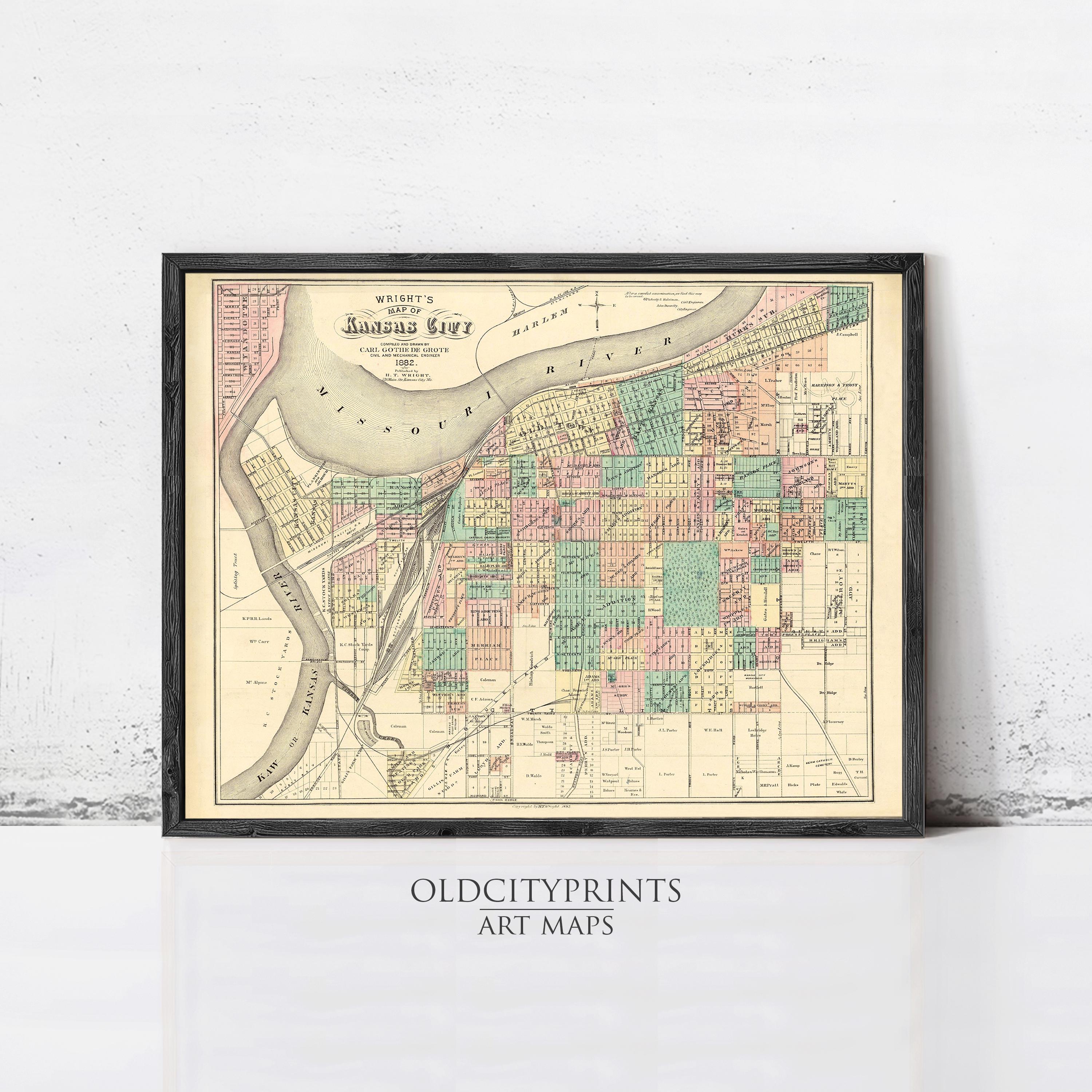 The image is a framed vintage map of the city of Kansas City, Missouri, with a black border and a white background.