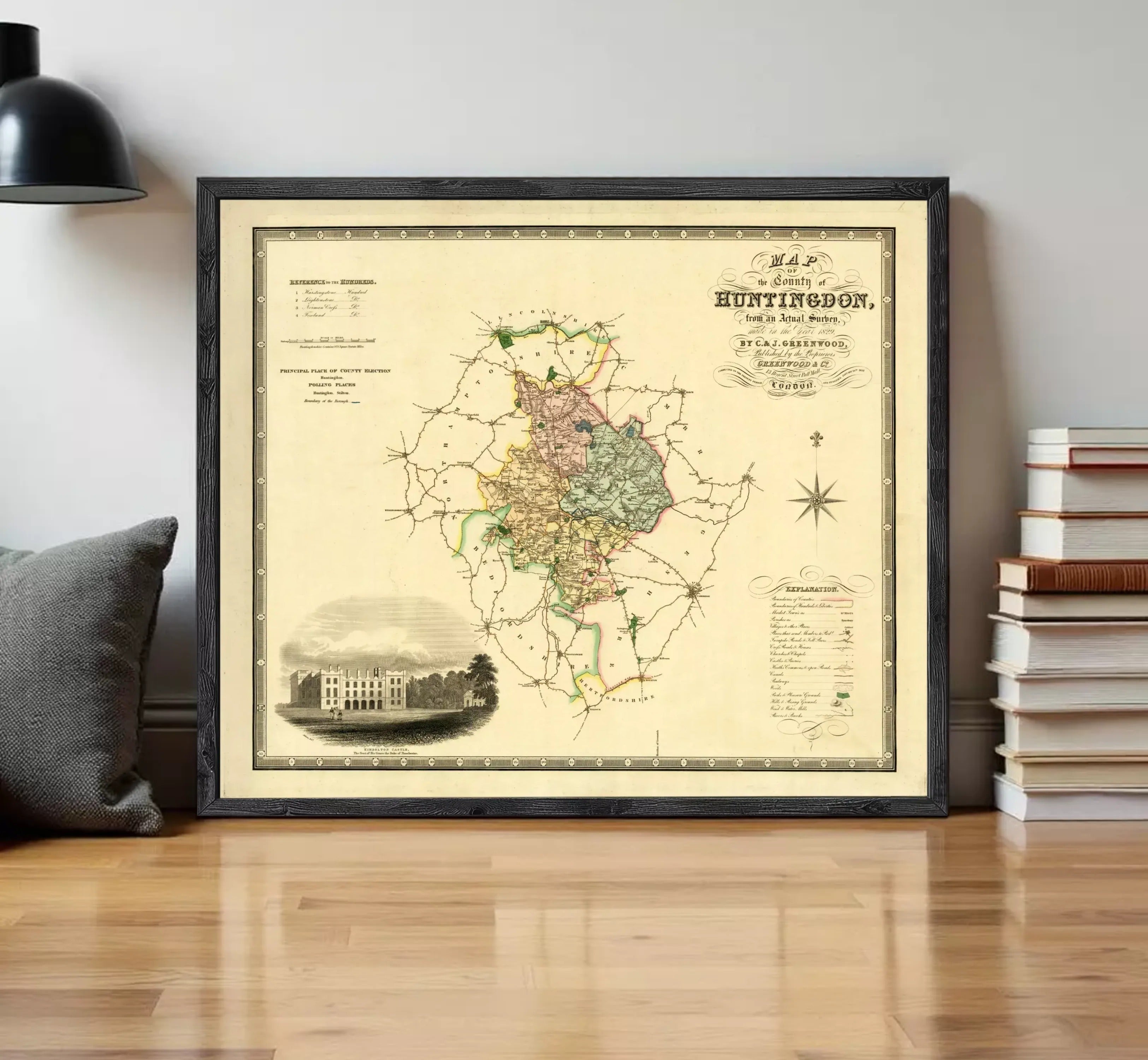 The image is a framed map of Huntingdon, showing a detailed layout of the area with various landmarks and geographical features.