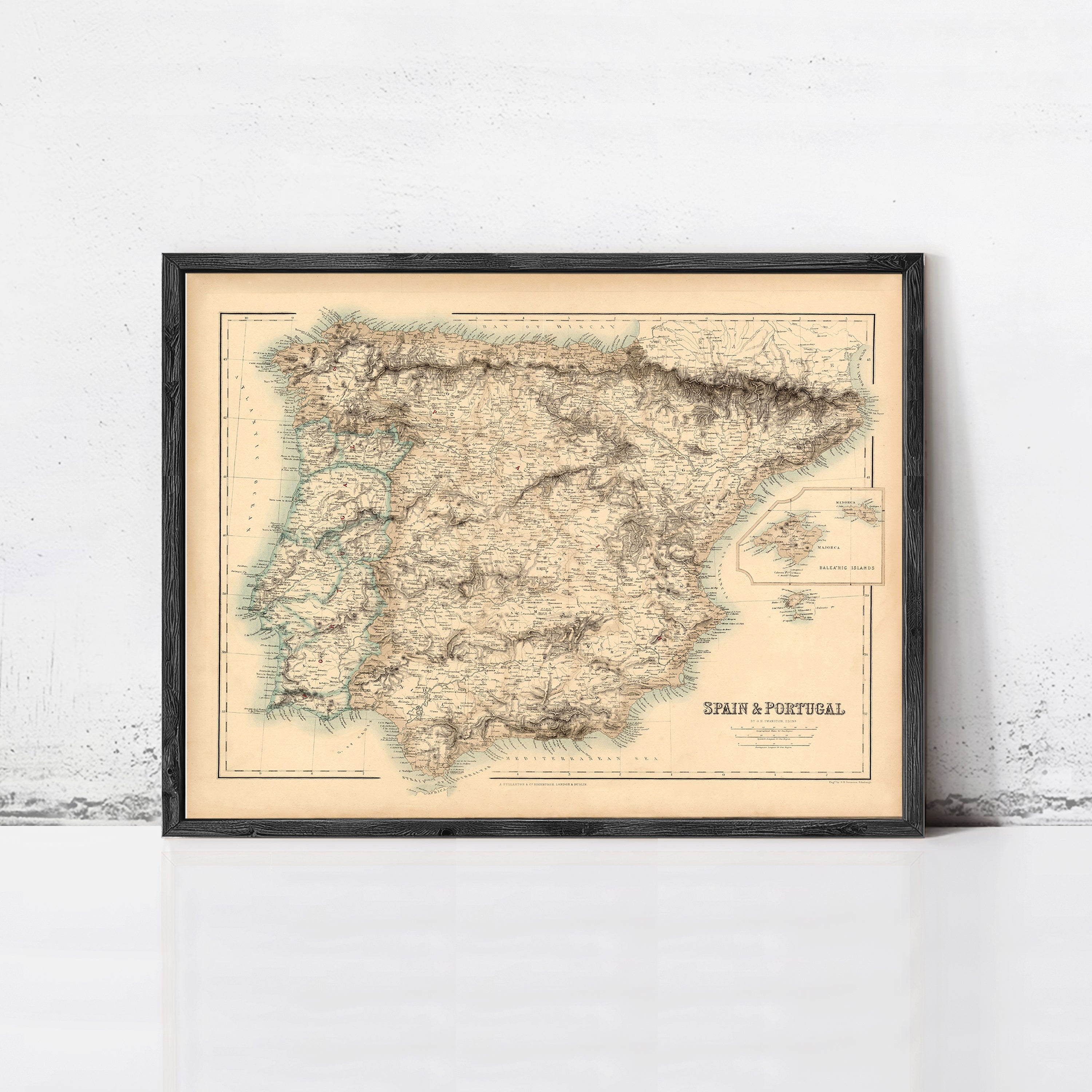 The image is a framed vintage map of Spain and Portugal, depicting the two countries in a detailed and intricate manner.
