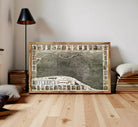 The image is a framed collage of various architectural and landscape elements, including buildings, roads, and natural features, all set against a white background.