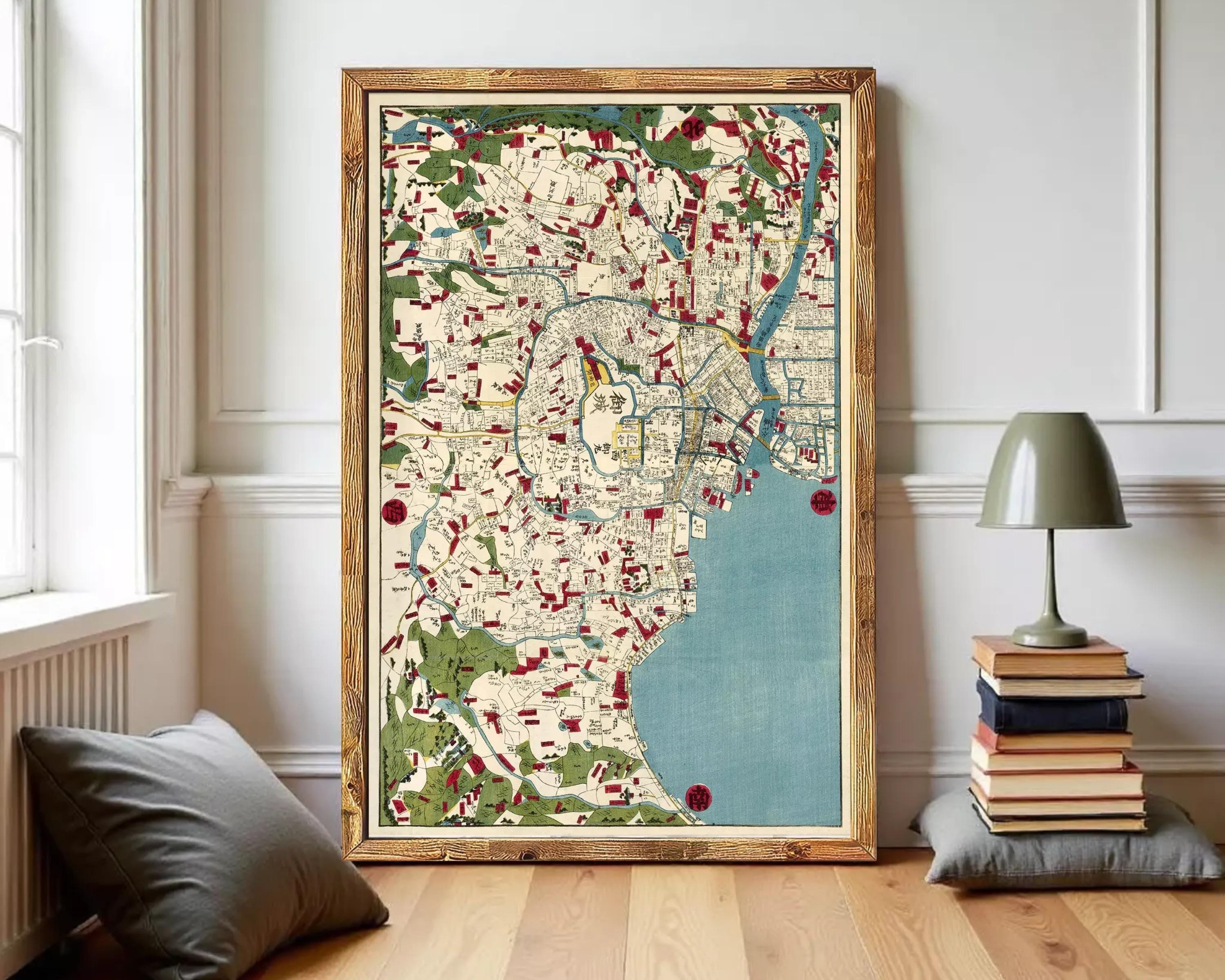 The image is a framed vintage map of a city, featuring a detailed and colorful depiction of the urban landscape.