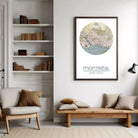 a living room with a bookshelf, a wooden bench, and a framed map of Montreal hanging on the wall.