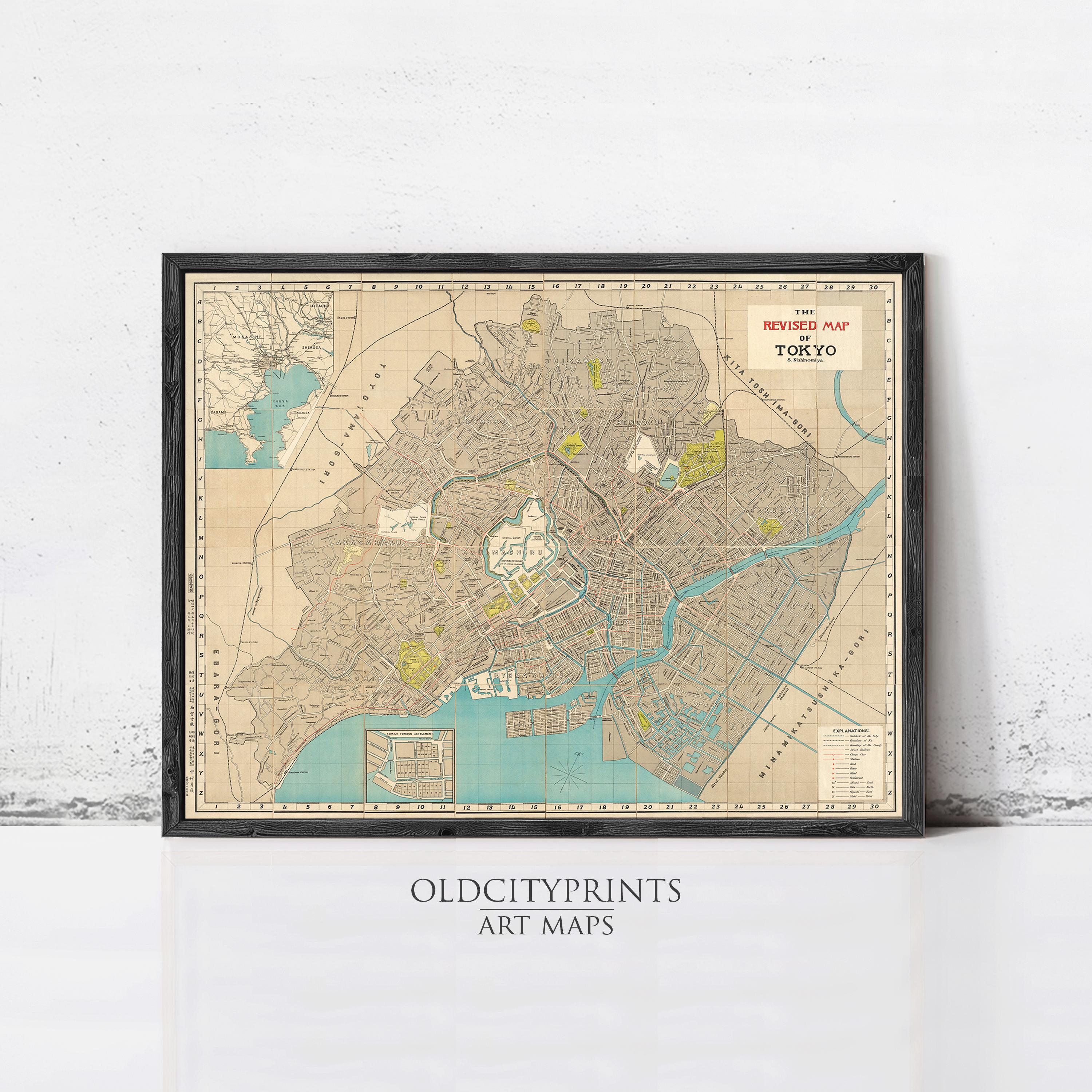 The image is a framed vintage map of Tokyo, Japan, depicting the city's streets, landmarks, and surrounding areas.