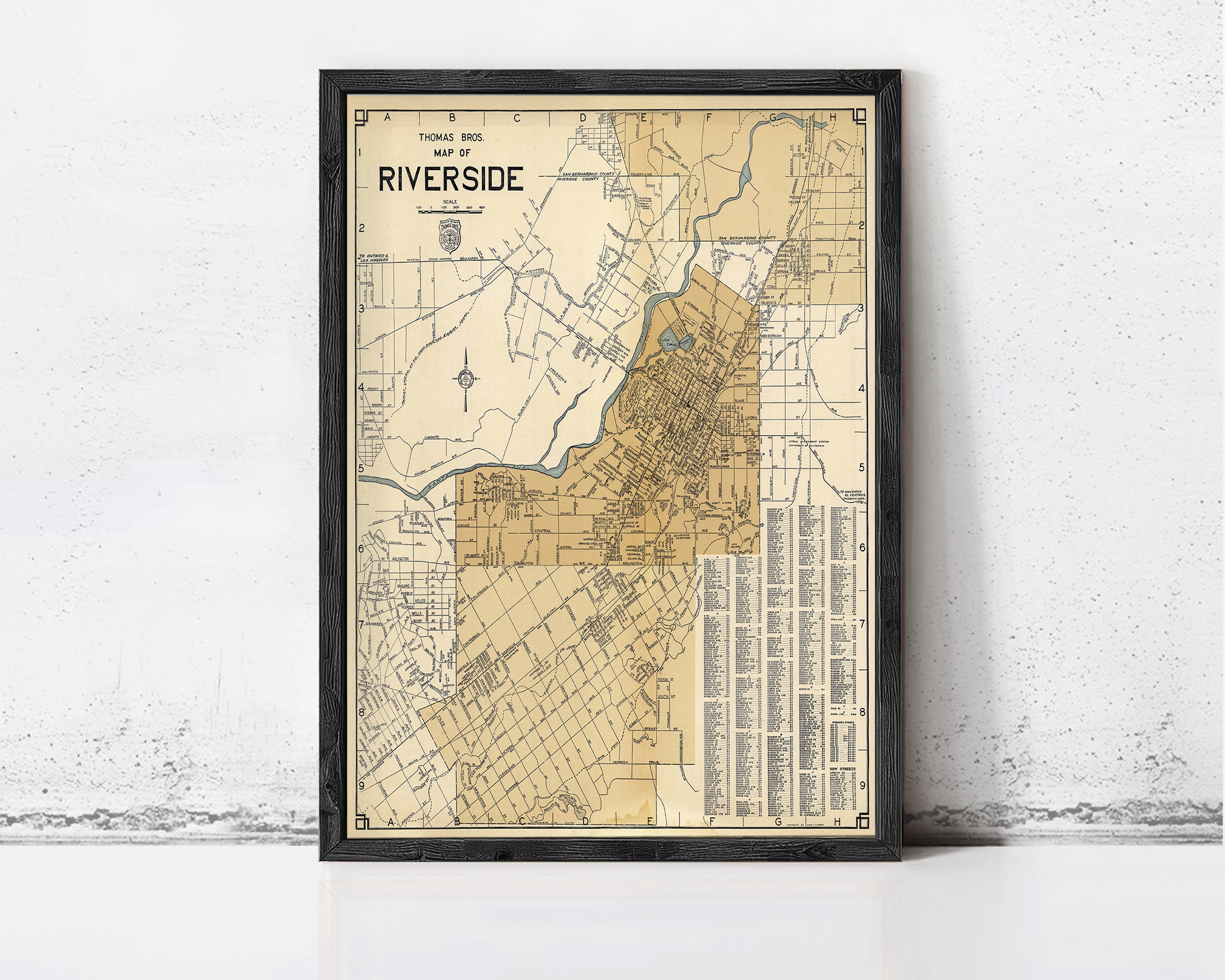 The image is a framed vintage map of Thomas Bros. Riverside, with a detailed layout of the area and surrounding streets.