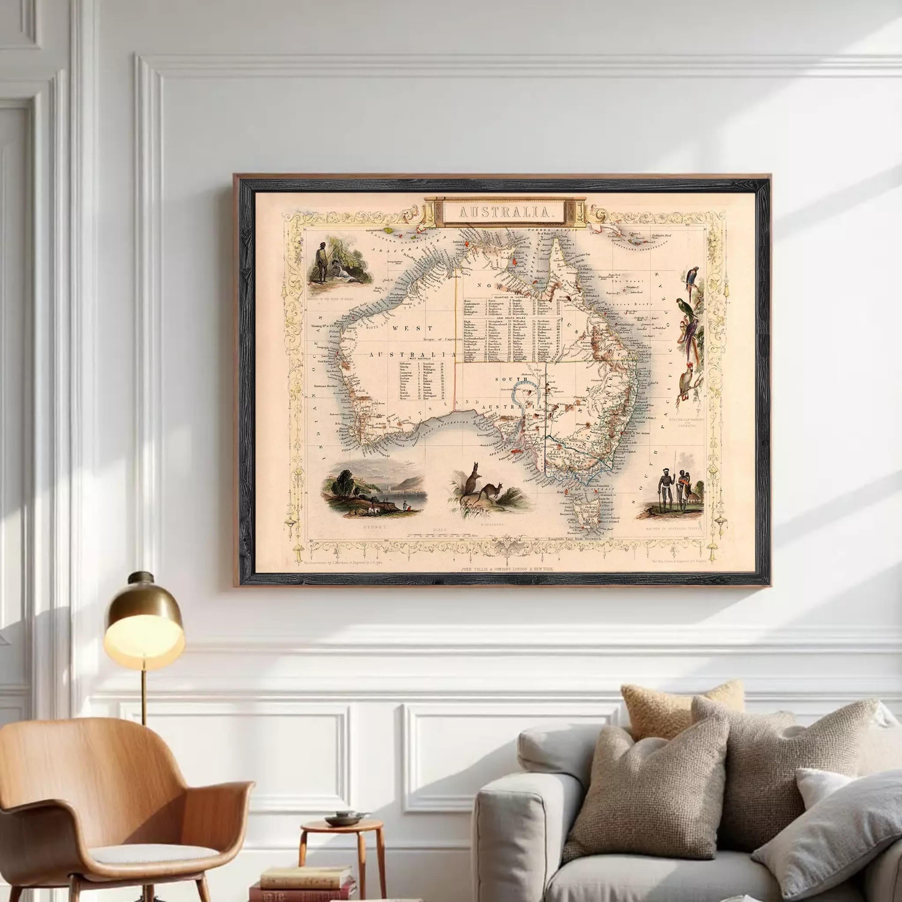 The image is a framed vintage map of Australia, featuring various illustrations and labels.