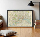 The image is a framed vintage map of London, depicting the city's streets, landmarks, and rivers.
