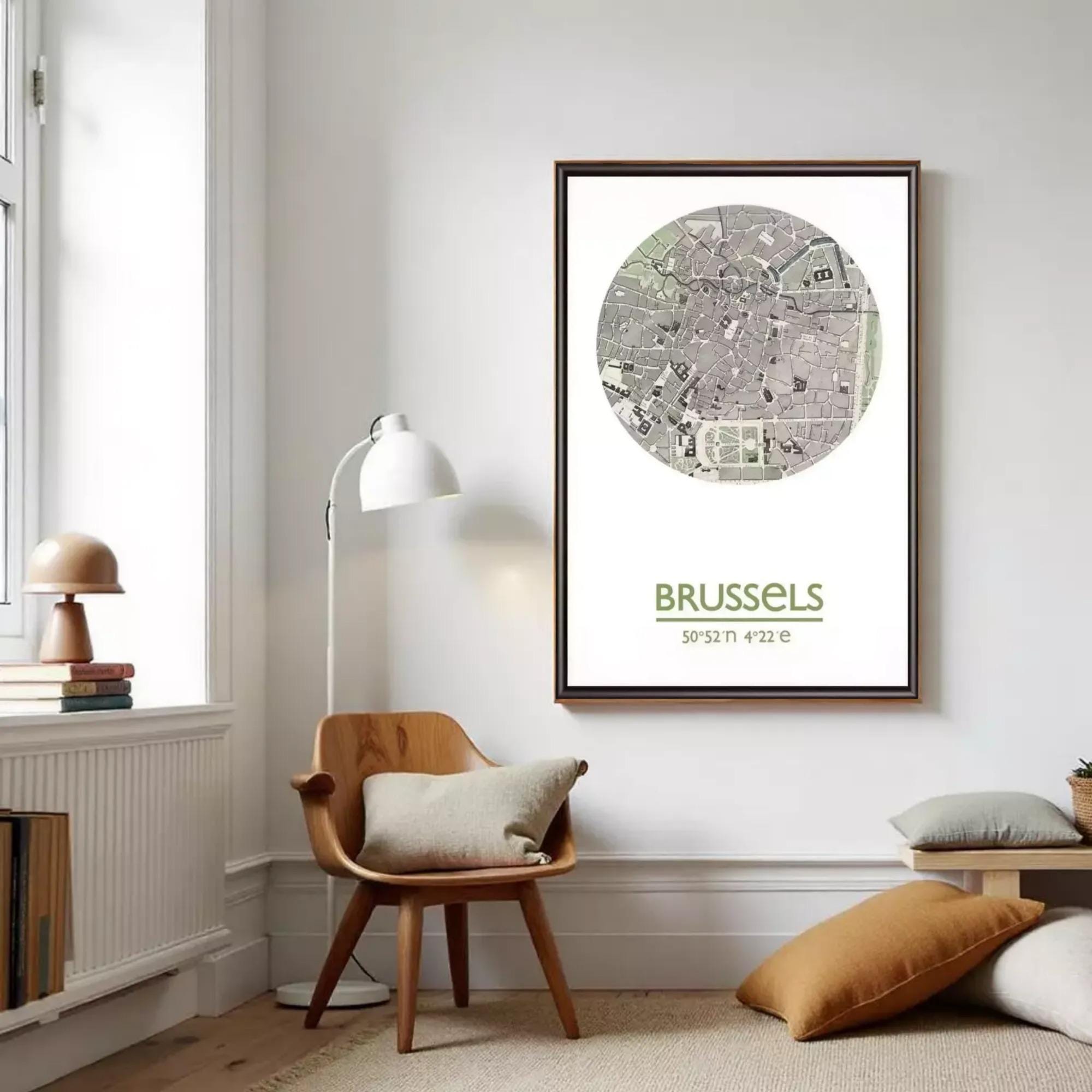 a living room with a wooden chair, a lamp, and a framed map of Brussels hanging on the wall.