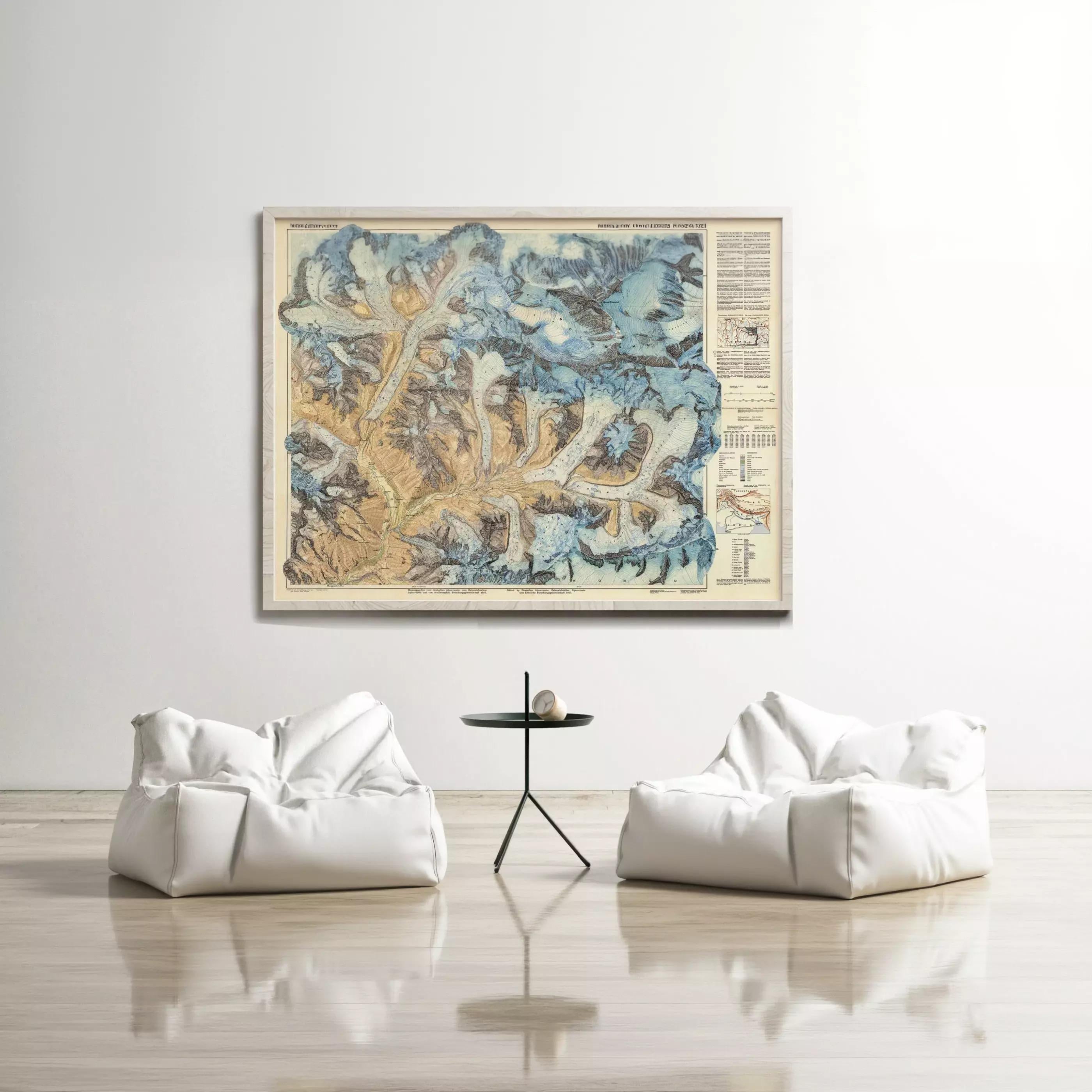 a large framed map hanging on a white wall, with two white bean bag chairs positioned in front of it.