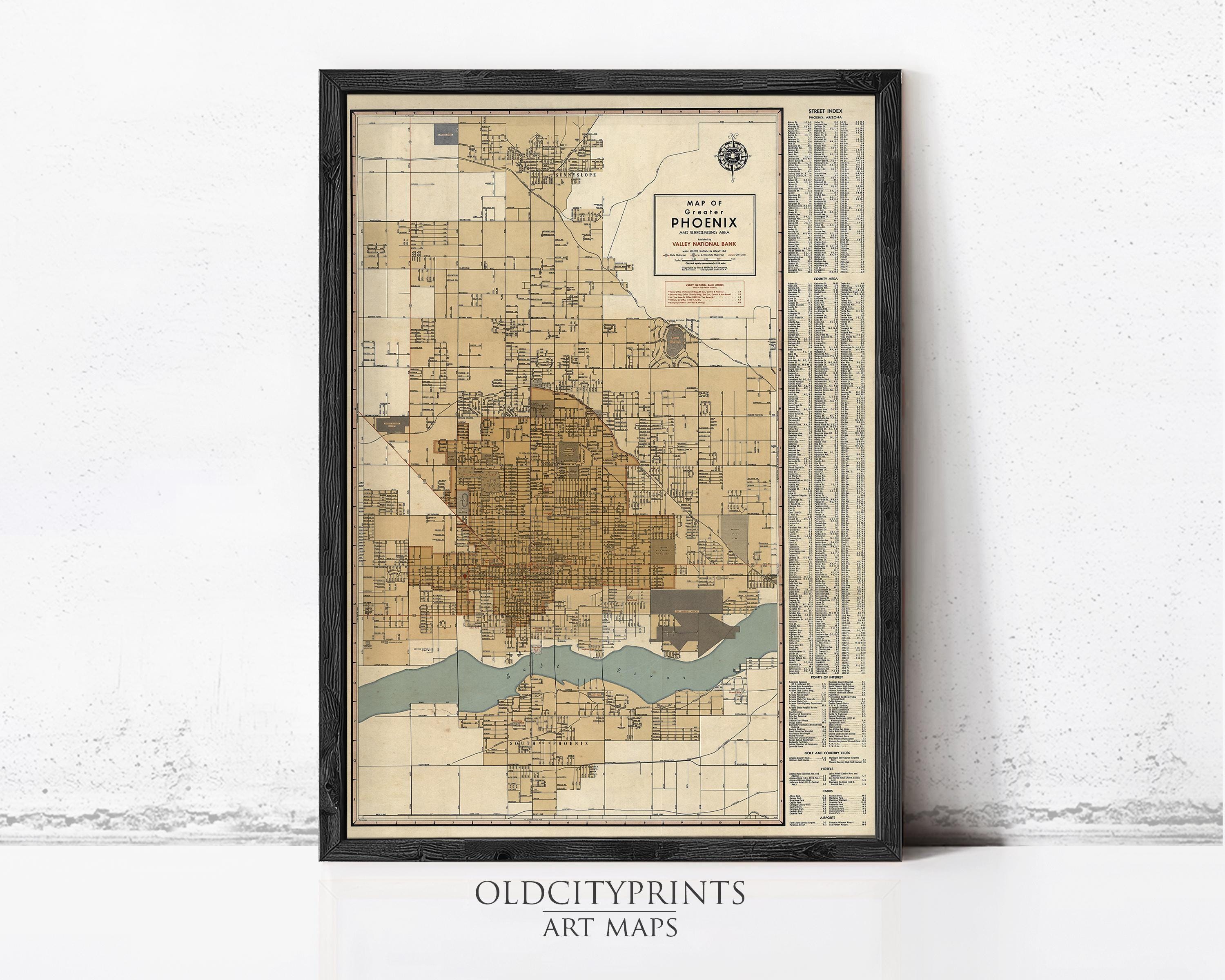 The image is a framed vintage map of Phoenix, Arizona, depicting the city's layout and surrounding areas.