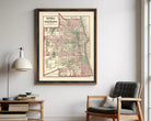 A framed map of Chicago, Illinois, with a vintage style and a color palette of red, green, and beige.