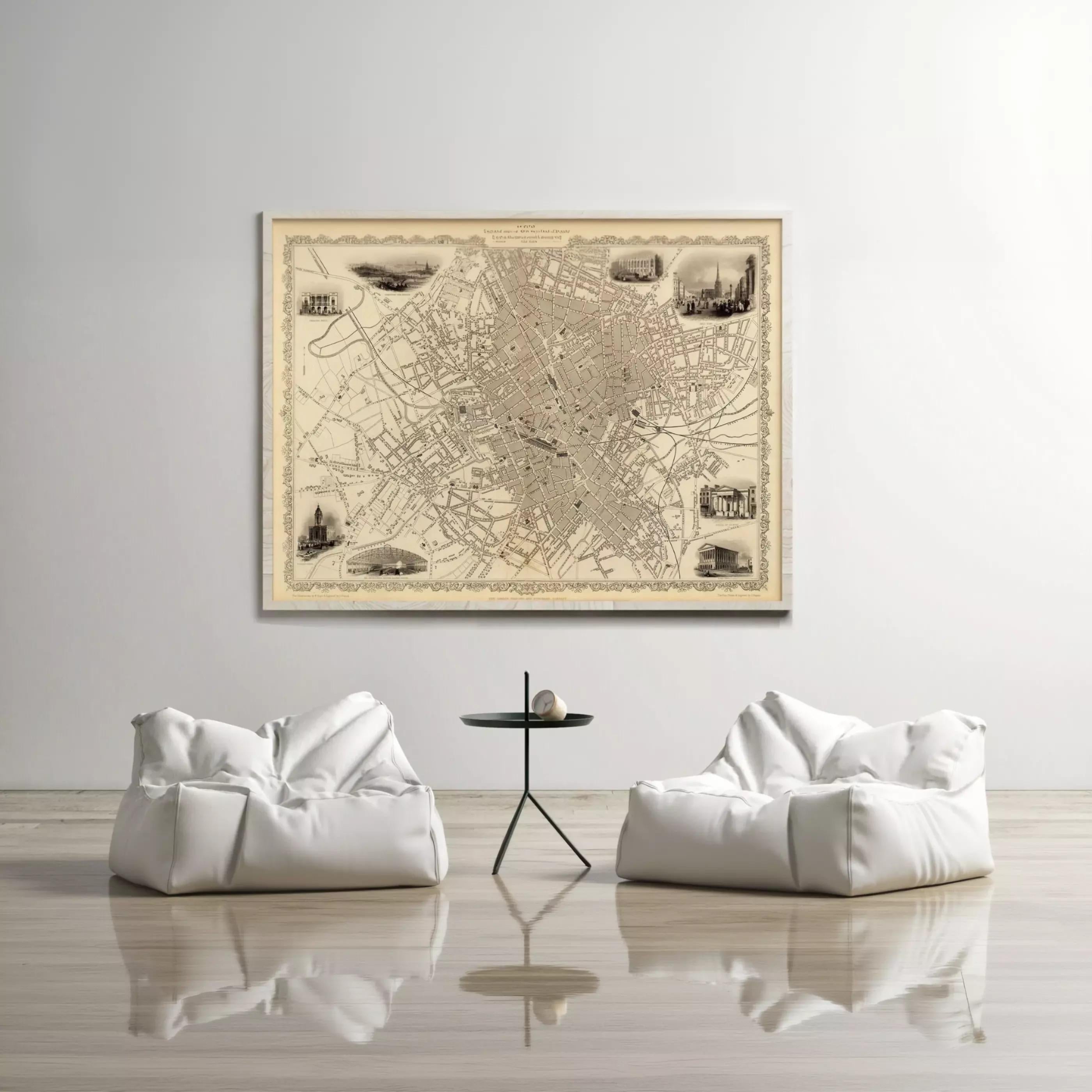 a large, antique-style map of a city displayed on the wall, with two white bean bag chairs positioned in front of it.