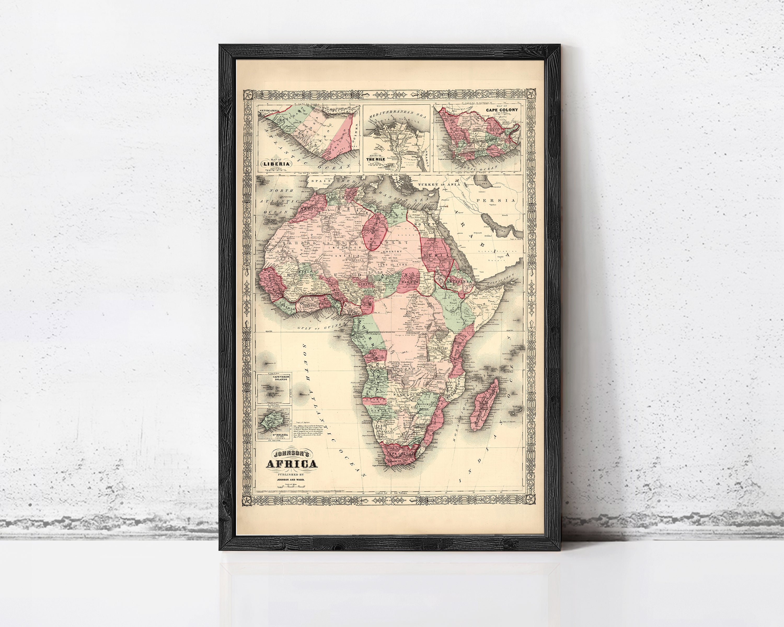 The image is a framed vintage map of Africa, depicting the continent in a detailed and colorful manner.