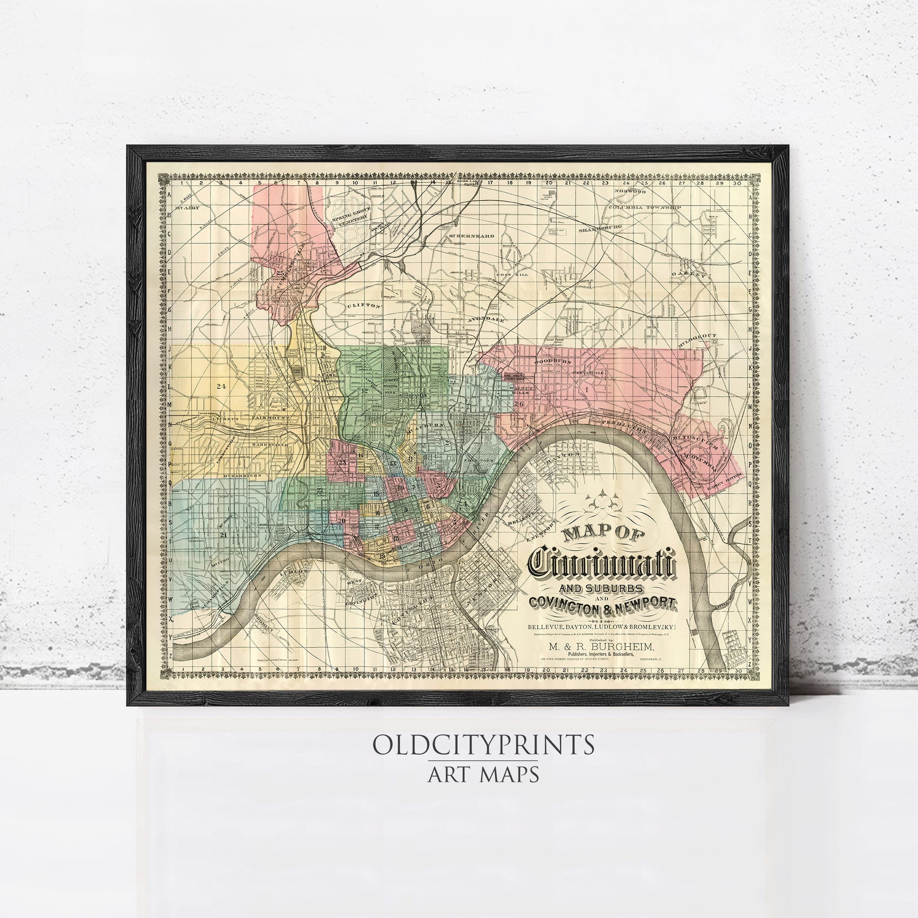 The image is a framed vintage map of Cincinnati, Ohio, with a detailed layout of the city's streets, neighborhoods, and landmarks.