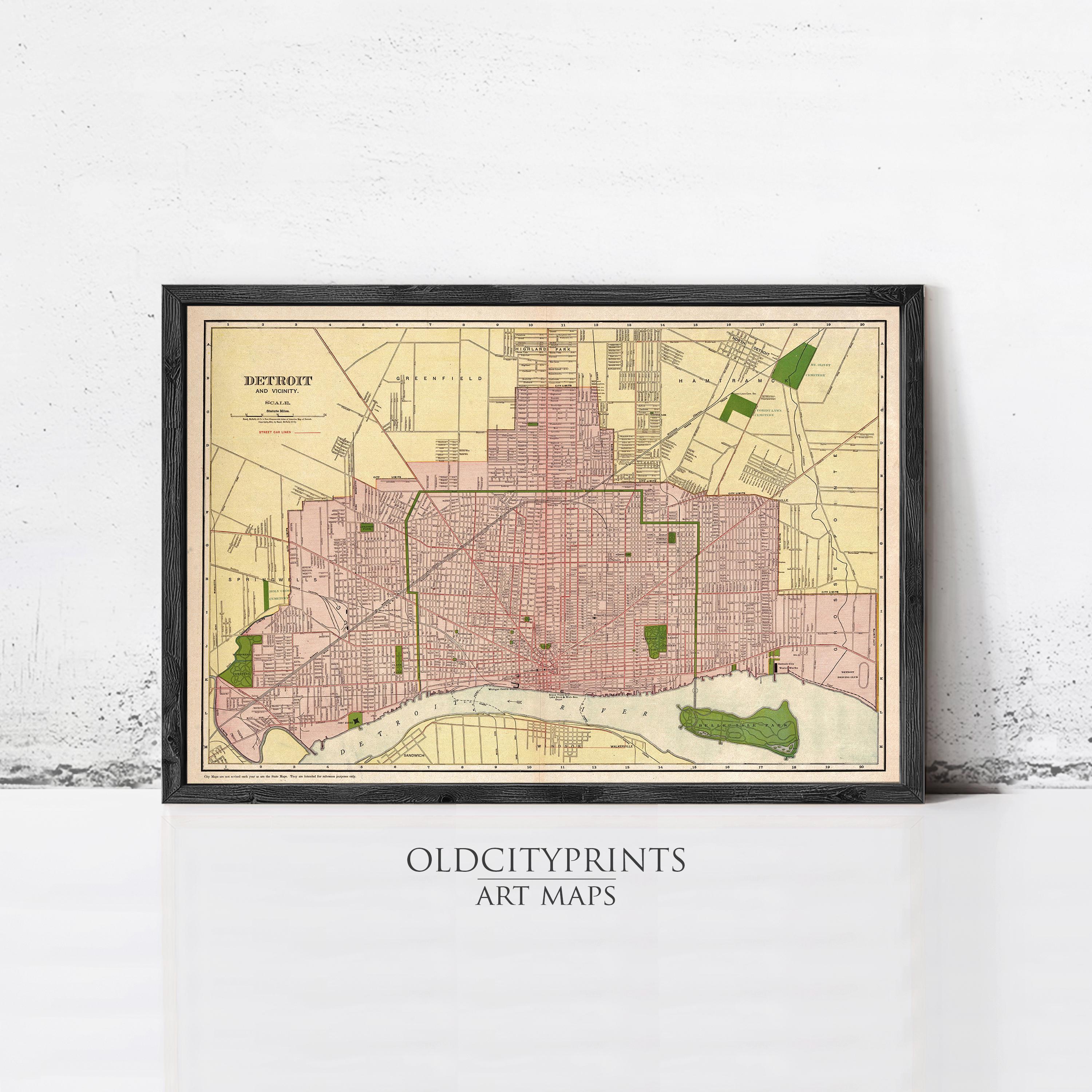 The image is a framed vintage map of Detroit, Michigan, depicting the city's streets and surrounding areas.