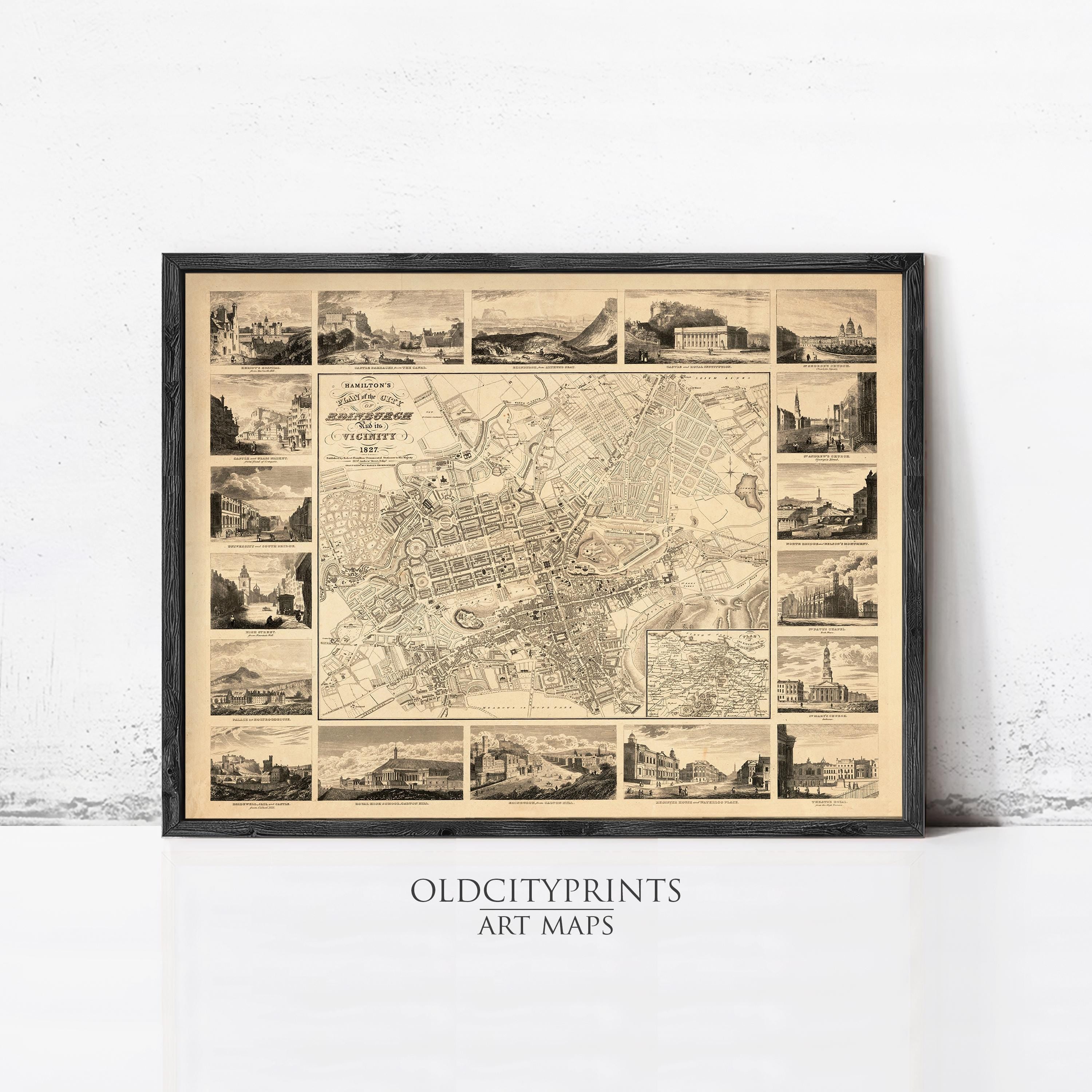 The image is a framed art print depicting a detailed map of a city, with various landmarks and buildings shown in a collage-like arrangement.