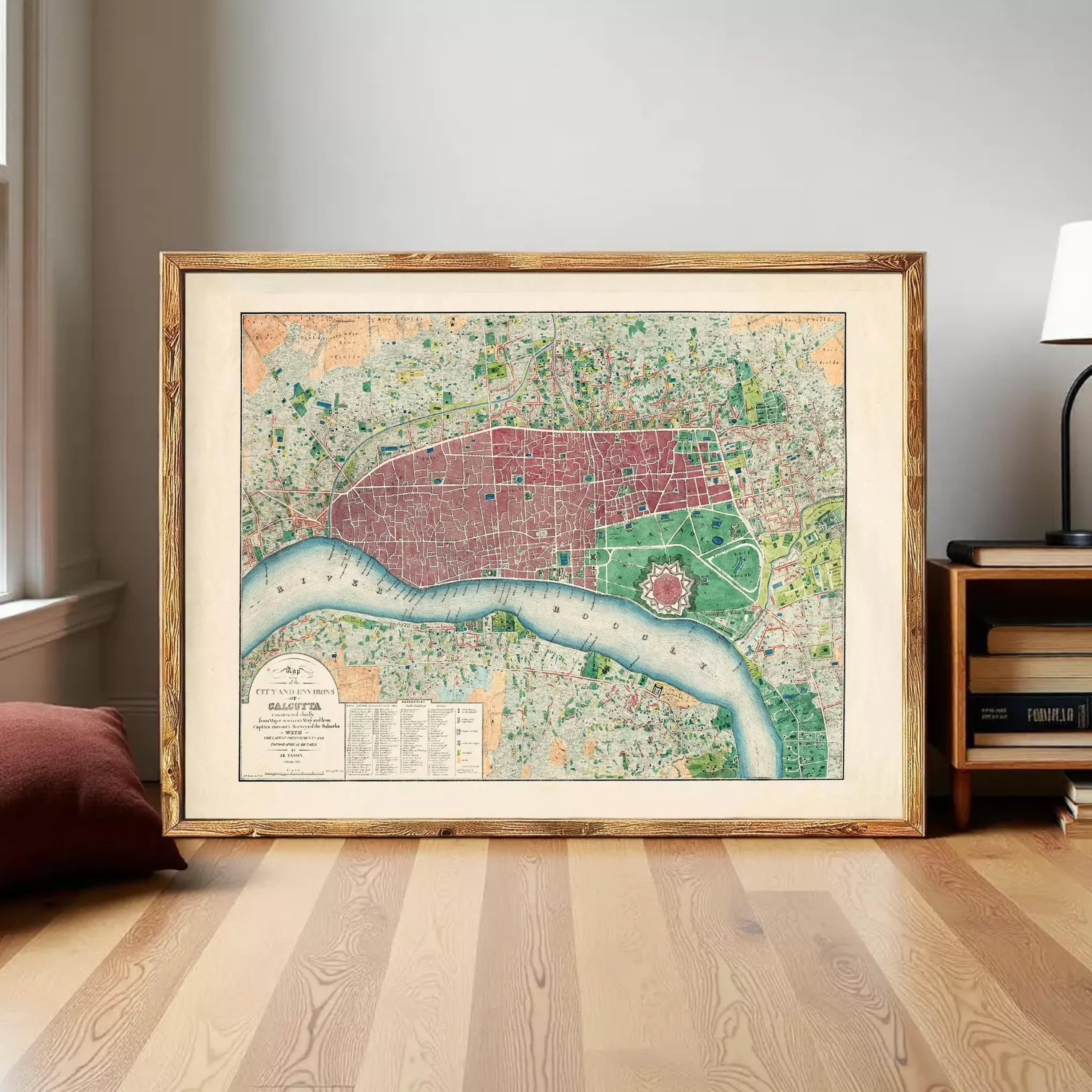 The image is a framed vintage map of London, England, depicting the city's streets and landmarks.