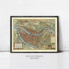 The image is a framed antique map of a city, likely from the 16th century, with detailed illustrations and labels.