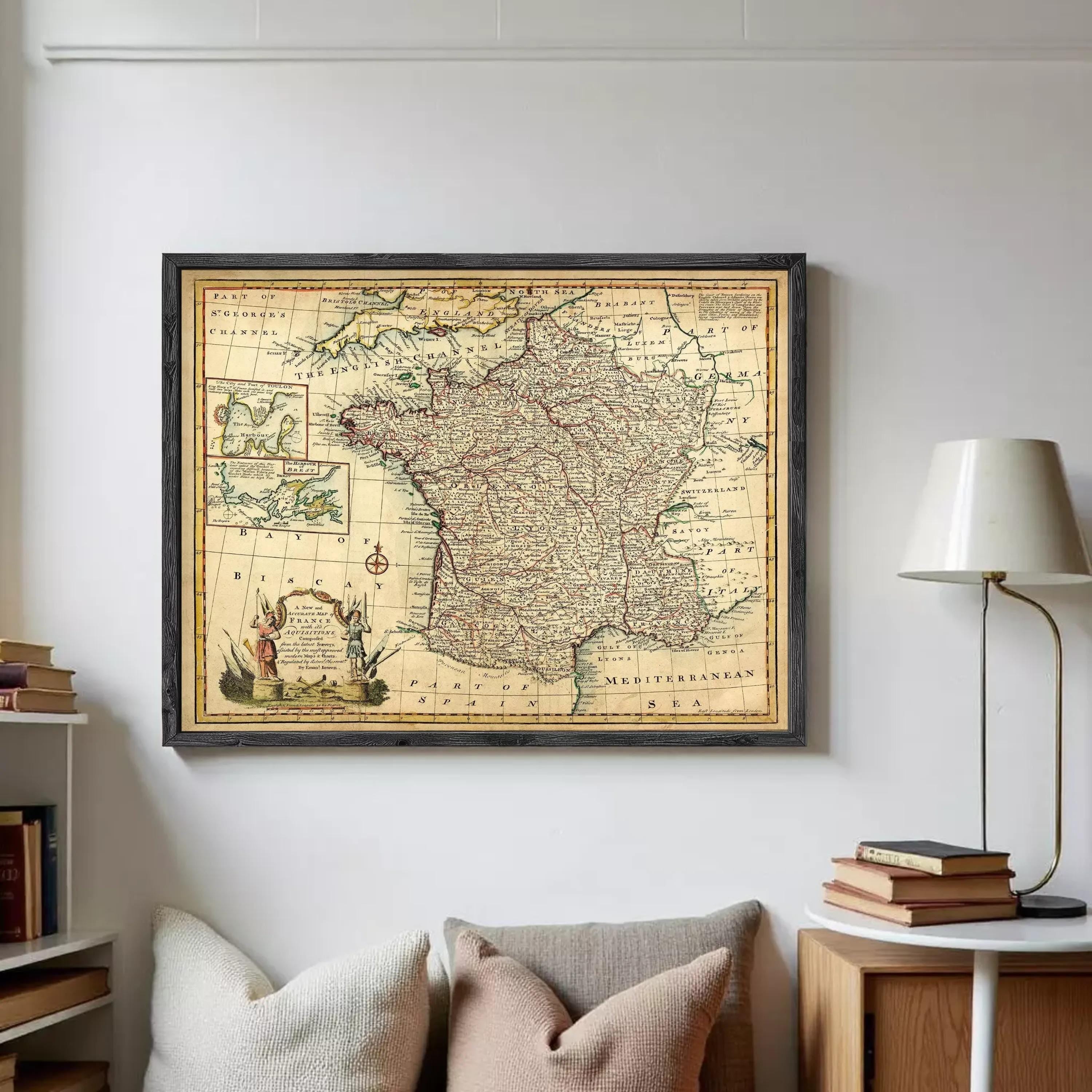 The image is a framed vintage map of France, depicting the country's geographical layout and surrounding regions.