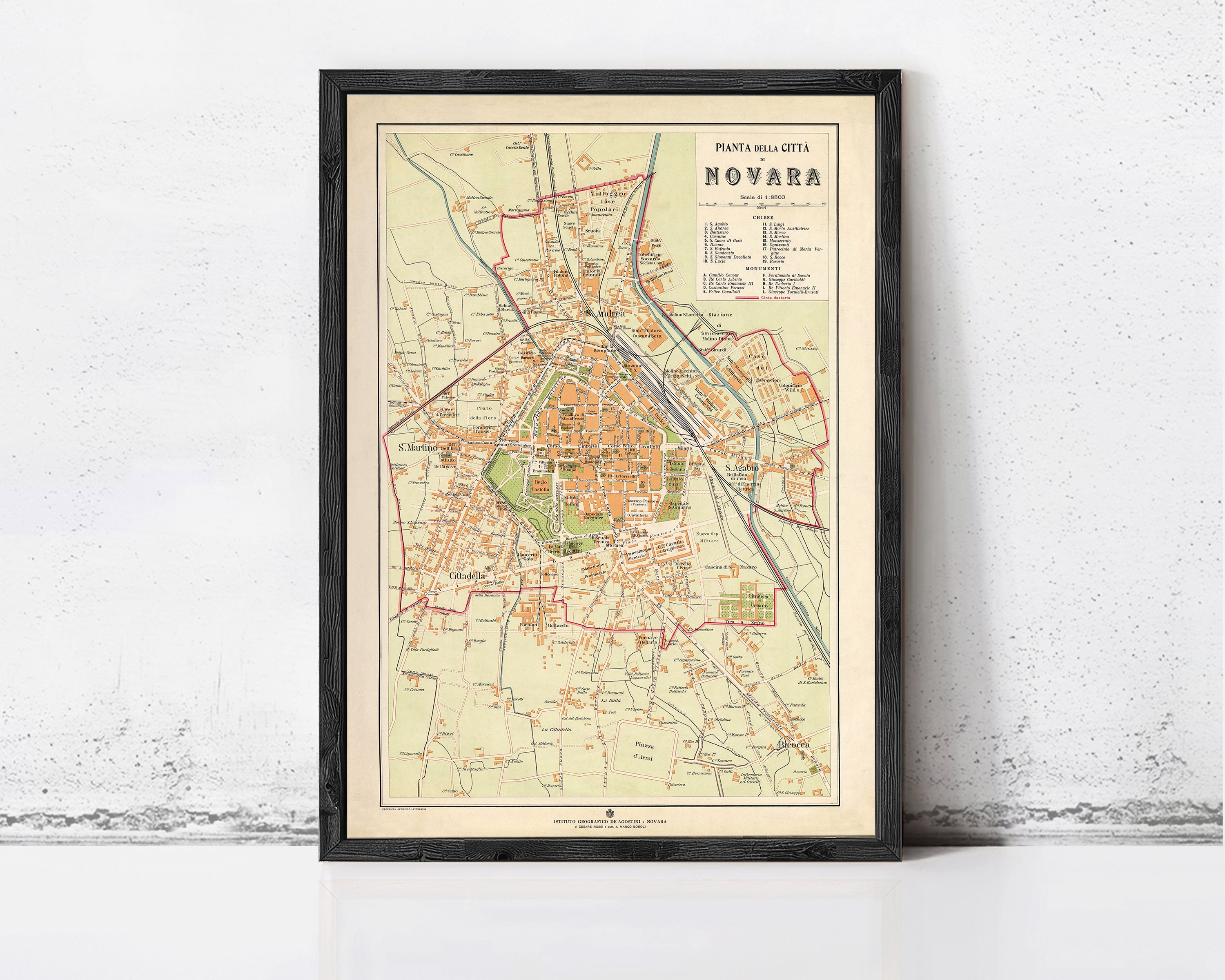 The image is a framed vintage map of Novara, showing the layout of the city and surrounding areas.