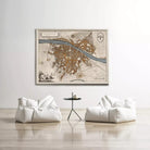 a large map of a city hanging on a wall, with two white bean bag chairs positioned in front of it.