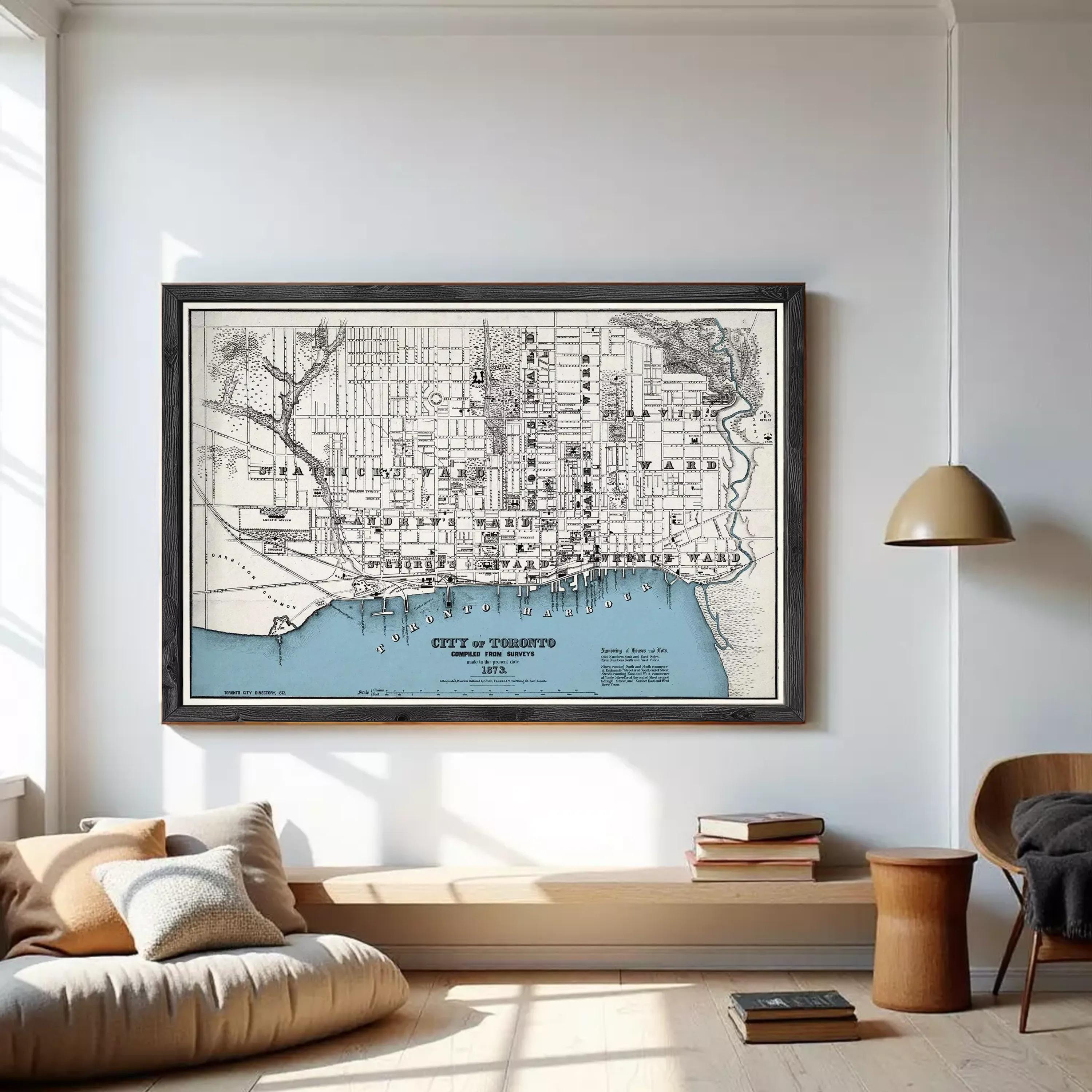 The image is a framed map of Toronto, Canada, depicting the city's streets and surrounding areas.