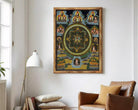 The image is a framed painting depicting a mandala with various Buddhist symbols and figures.