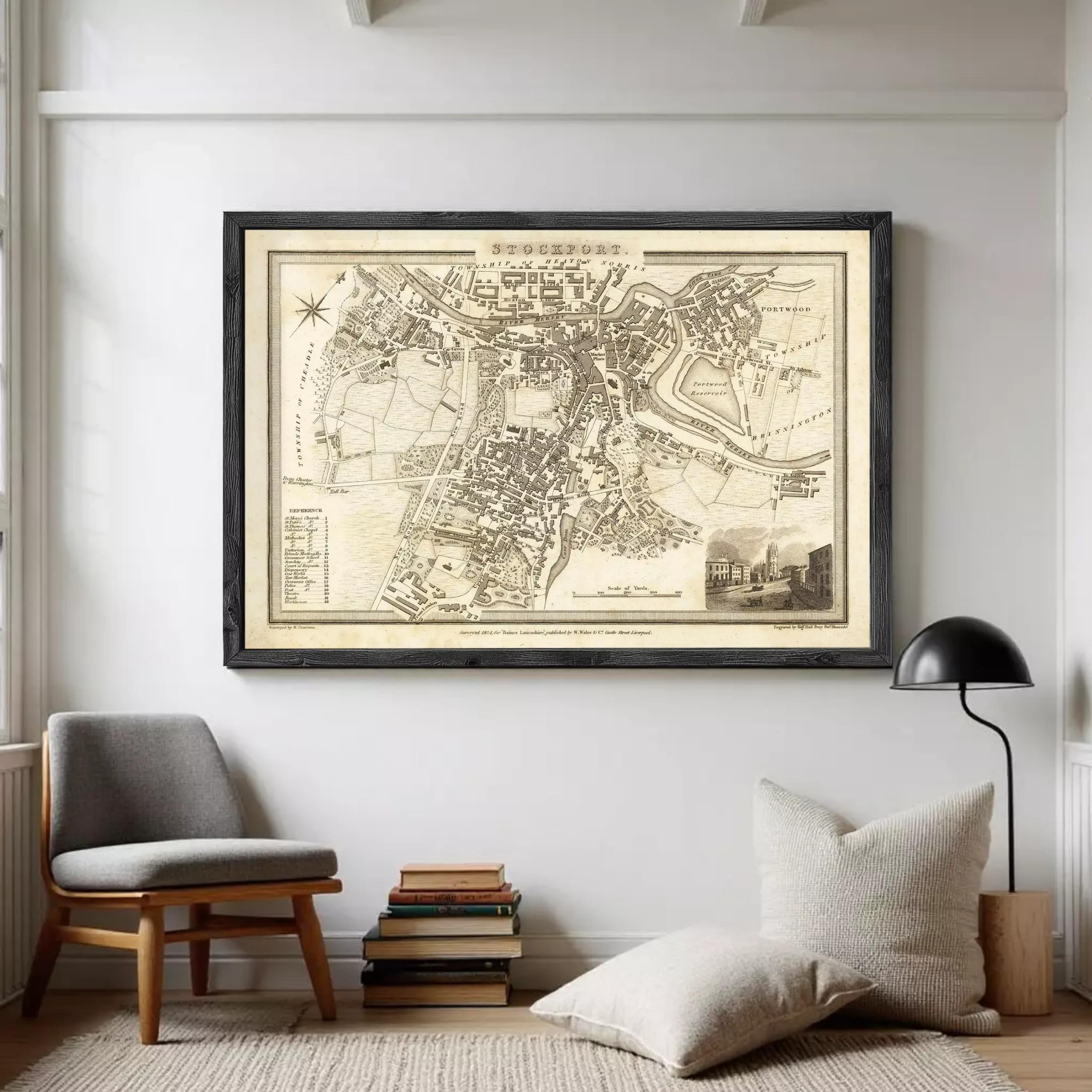 The image is a framed antique map of a city, likely from the 18th century, depicting a detailed layout of the city and surrounding areas.