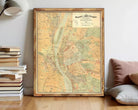 The image is a framed vintage map of Budapest, Hungary, depicting the city's streets and surrounding areas.