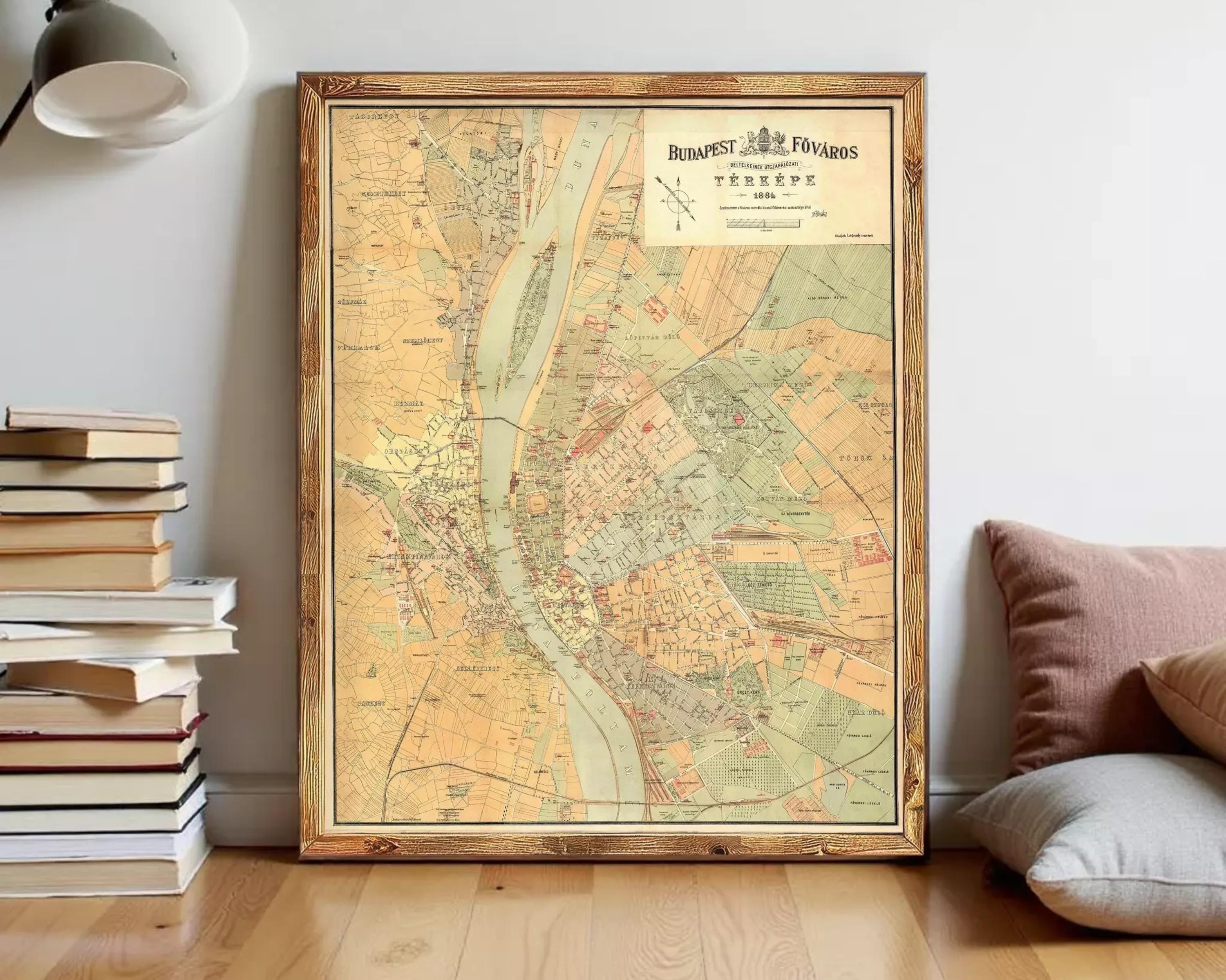 The image is a framed vintage map of Budapest, Hungary, depicting the city's streets and surrounding areas.