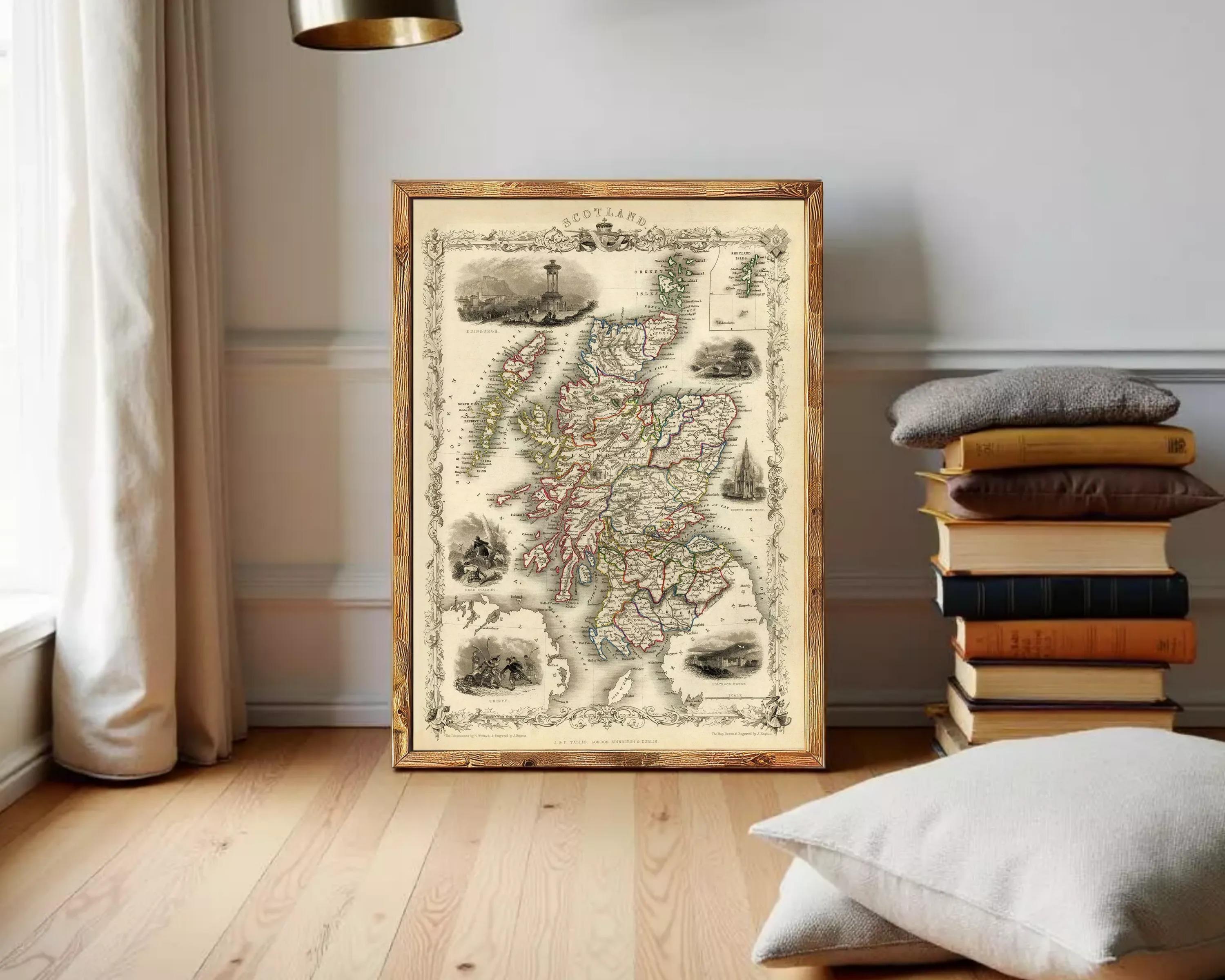 The image is a framed antique map of Scotland, featuring detailed illustrations and labels.