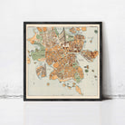 The image is a framed map of a city, likely from the 19th century, with a vintage style and a detailed layout of the streets, buildings, and surrounding areas.