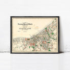 The image is a framed vintage map of Cleveland, Ohio, depicting the city's layout and surrounding areas.