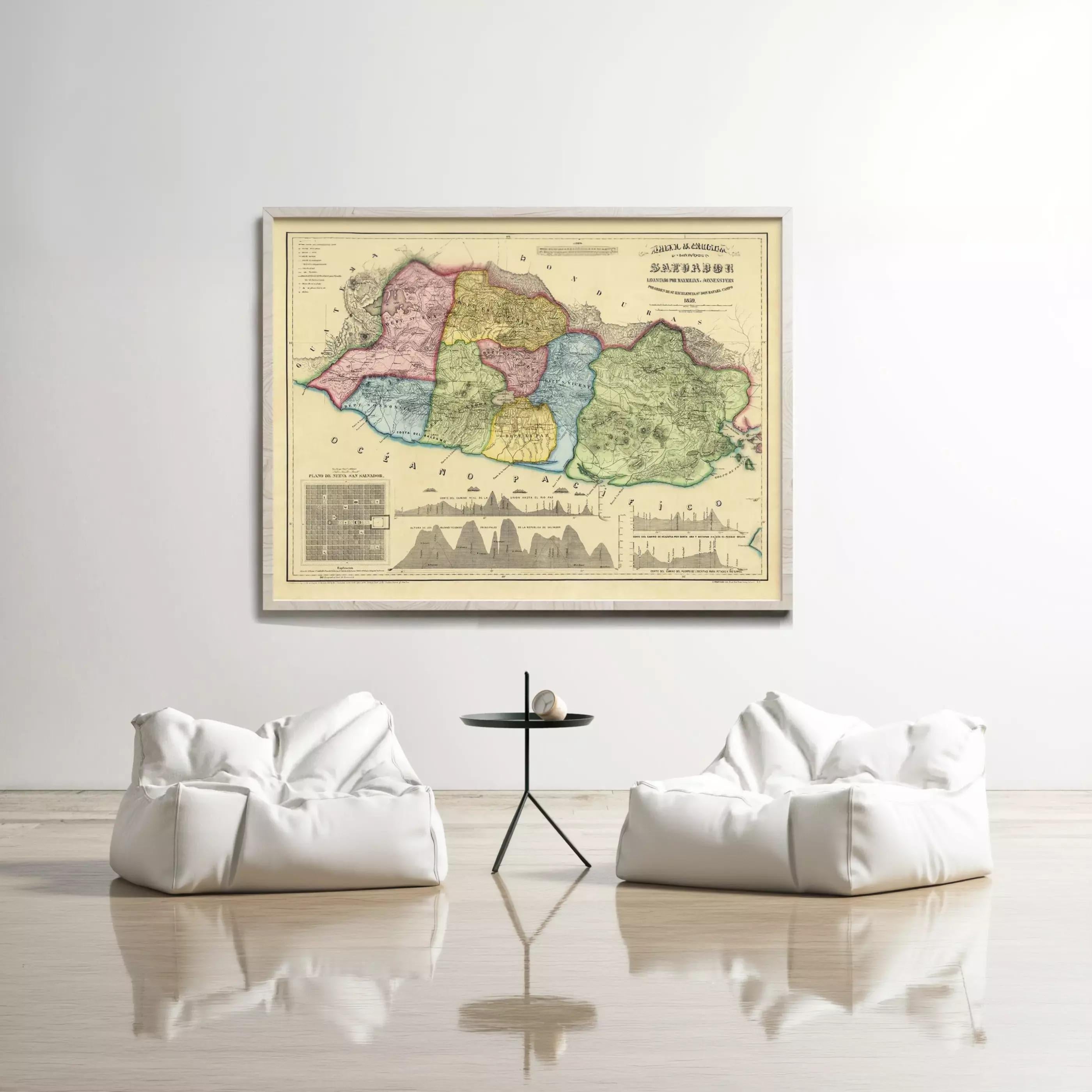 a large, colorful map of a region hanging on a wall, with two white bean bag chairs positioned in front of it.