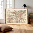 The image is a framed vintage map of Prague, Czech Republic, depicting the city's streets and landmarks.