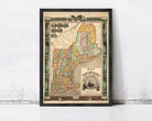 The image is a framed vintage map of New England, depicting the region in a detailed and colorful manner.