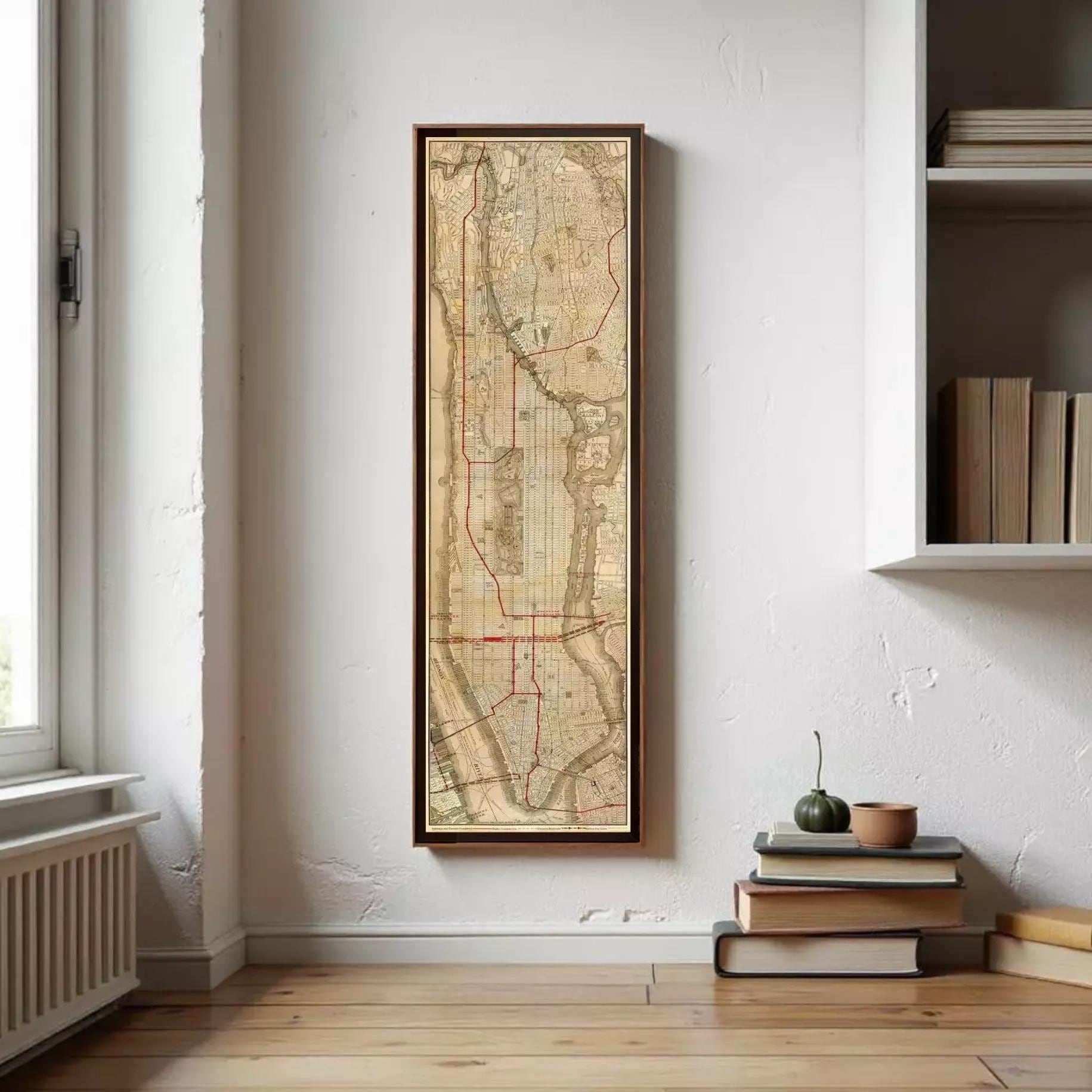 A framed map of New York City, likely depicting the subway system, is displayed against a white wall.