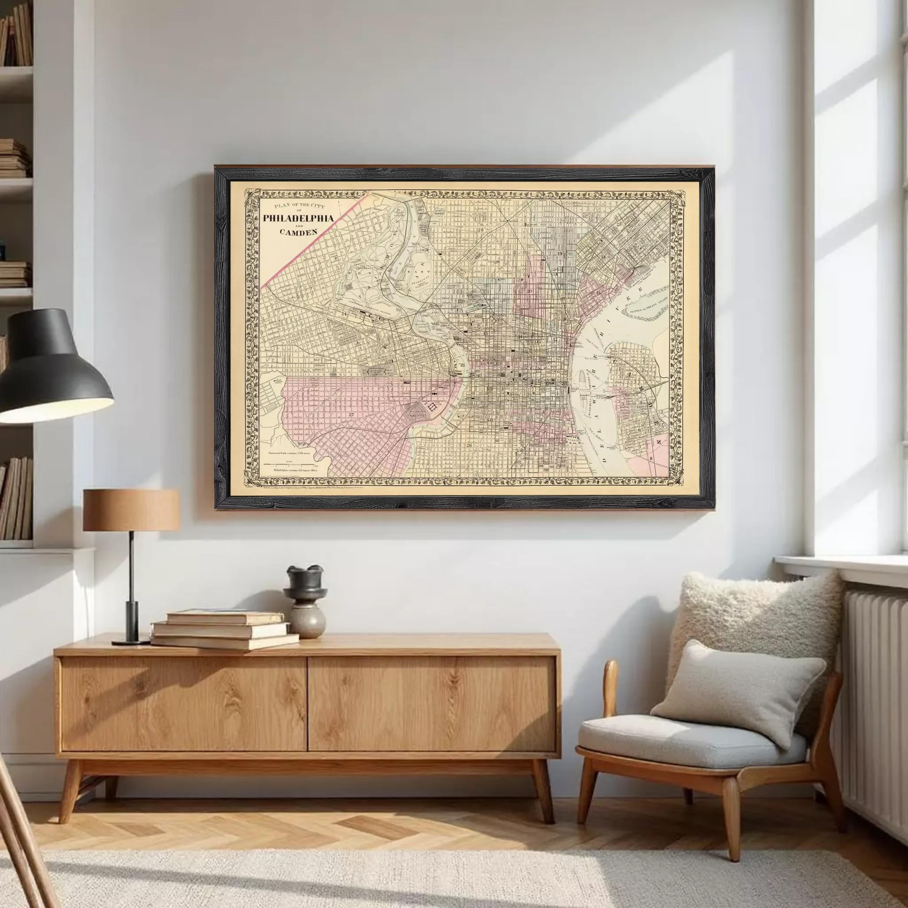 The image is a framed vintage map of Philadelphia, Pennsylvania, depicting the city's streets and neighborhoods.