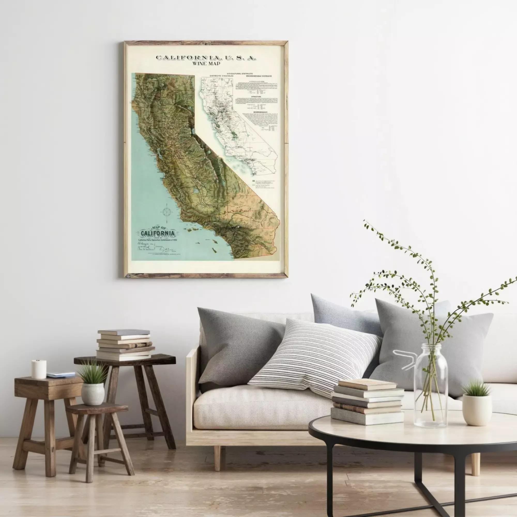 a framed vintage map of California, with a cozy living room setting in the background.