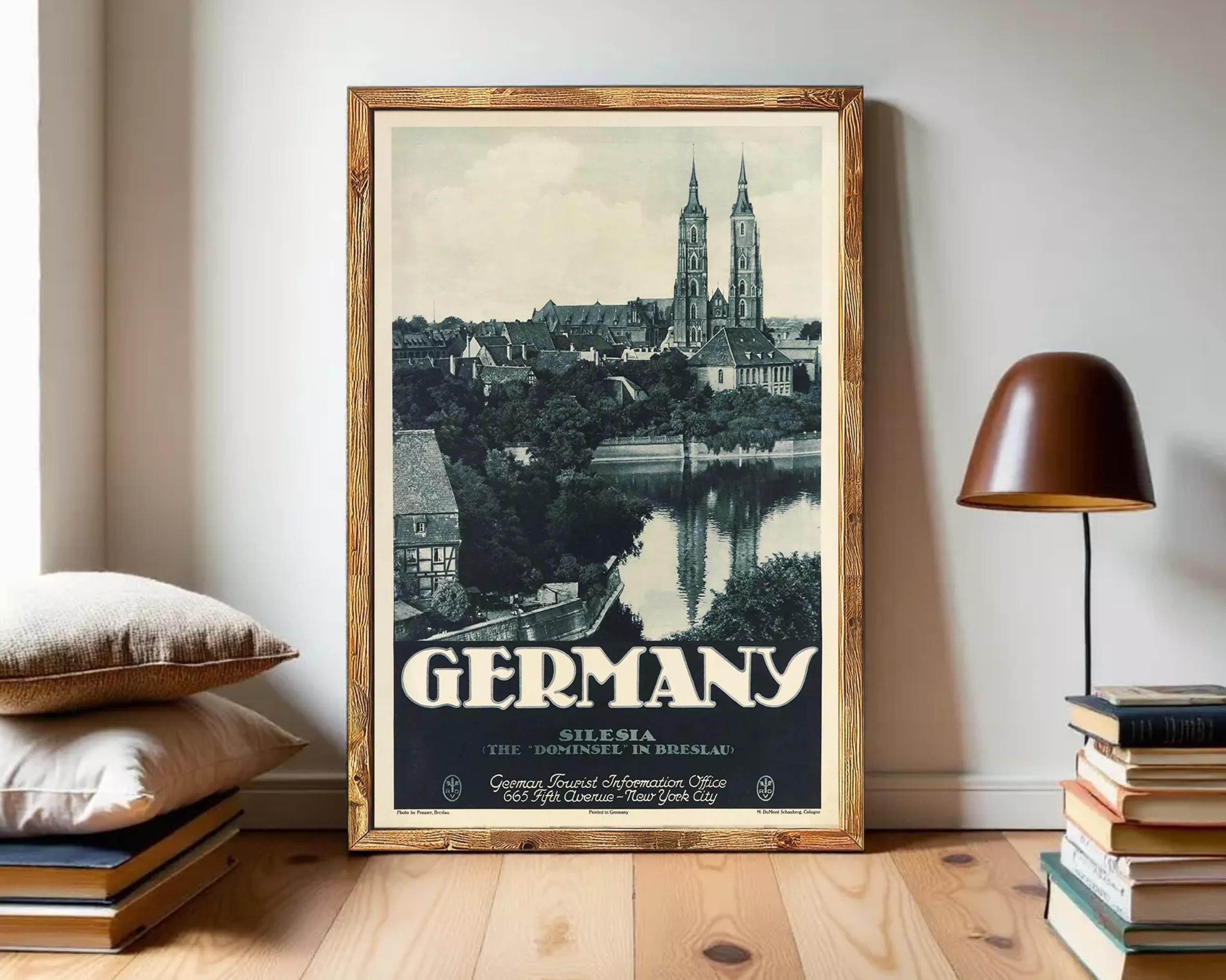 A framed vintage travel poster depicting the city of Silesia, Germany, with the city's iconic cathedral spires visible in the background.
