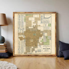 The image is a framed vintage map of Tucson, Arizona, depicting the city's layout and surrounding areas.