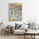 a large framed map of Italy hanging on a wall in a living room setting.