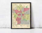 The image is a framed map of a city, showing various neighborhoods and streets.